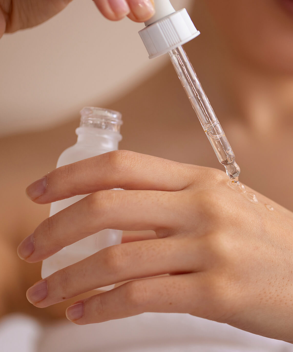 front-view-woman-using-serum